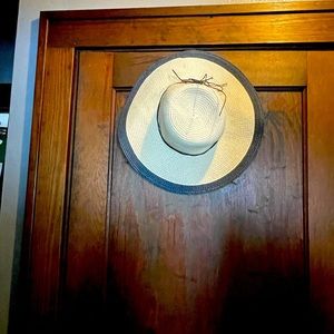 Straw and navy blue sun hat.